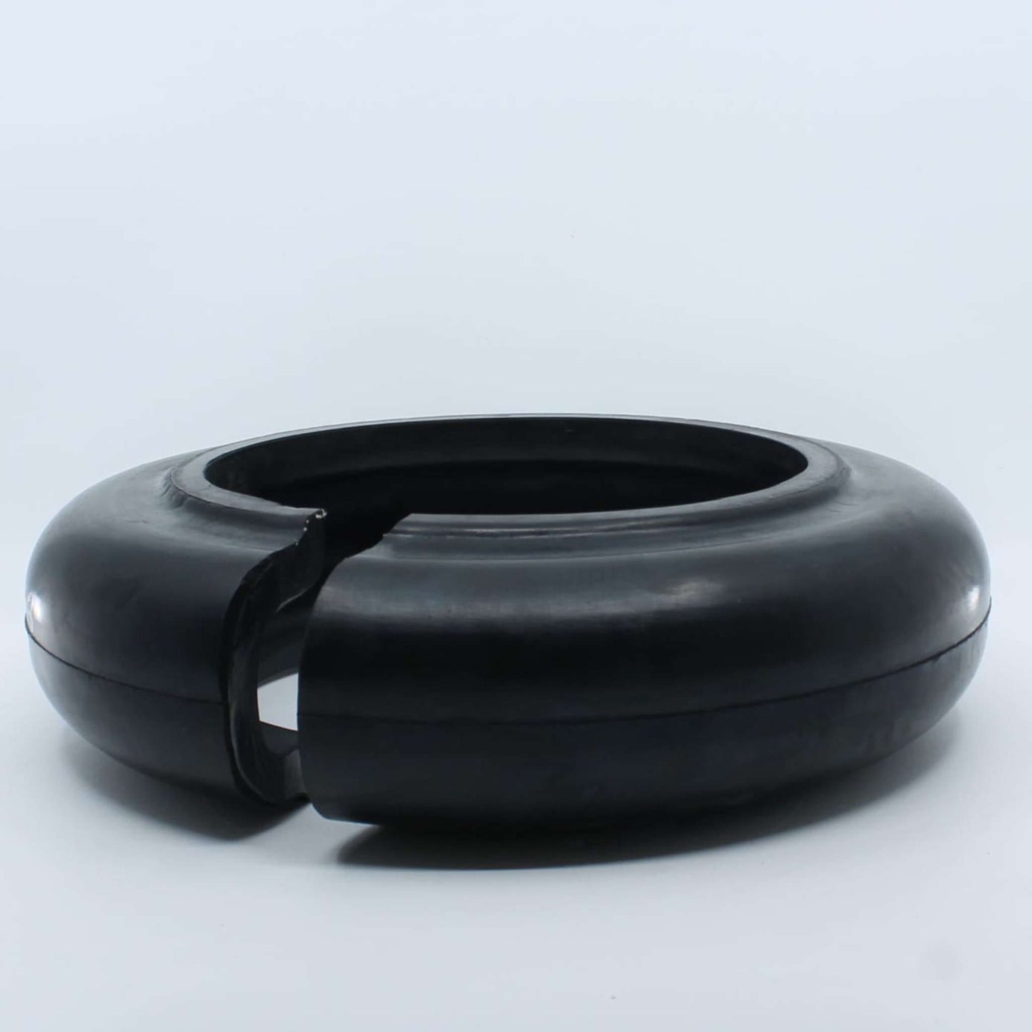 Flector elástico de caucho UNE M8 66/75 para desbrozadora con diámetro interior de 200 mm, exterior de 320 mm y grosor de 90 mm.
