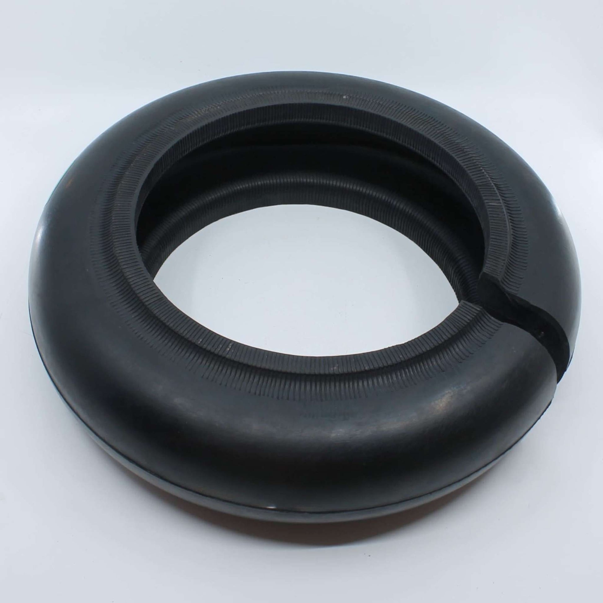 Flector elástico de caucho UNE M9 76/85 para desbrozadora con diámetro interior de 220 mm, exterior de 360 mm y grosor de 100 mm.
